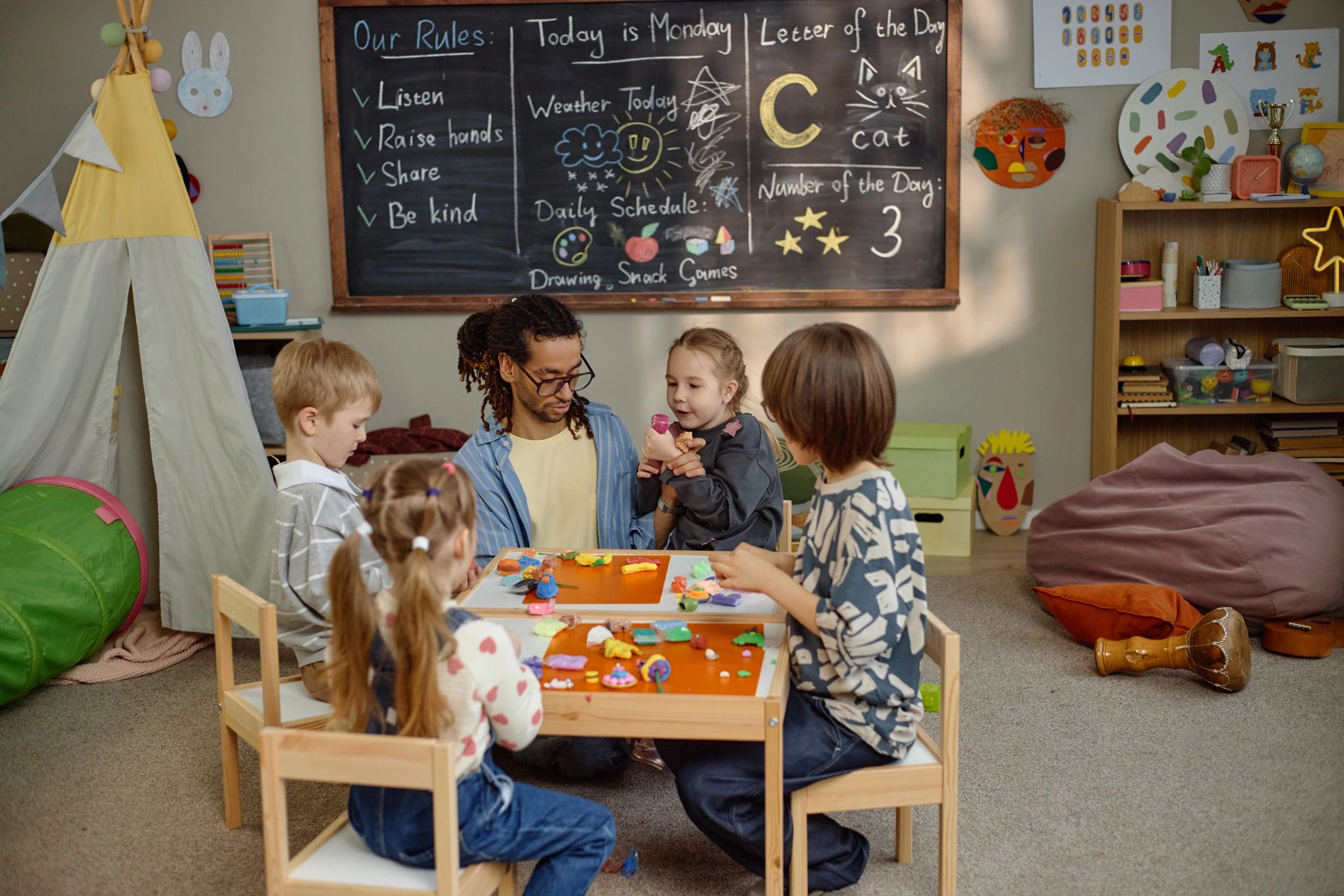 Inclusive classroom with teacher and students creating together